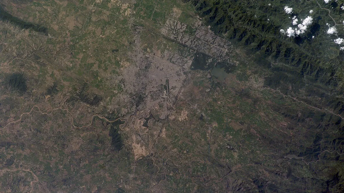 Astronaut photo of Islamabad and Rawalpindi, showing Islamabad's grid of sectors below the Margalla Hills