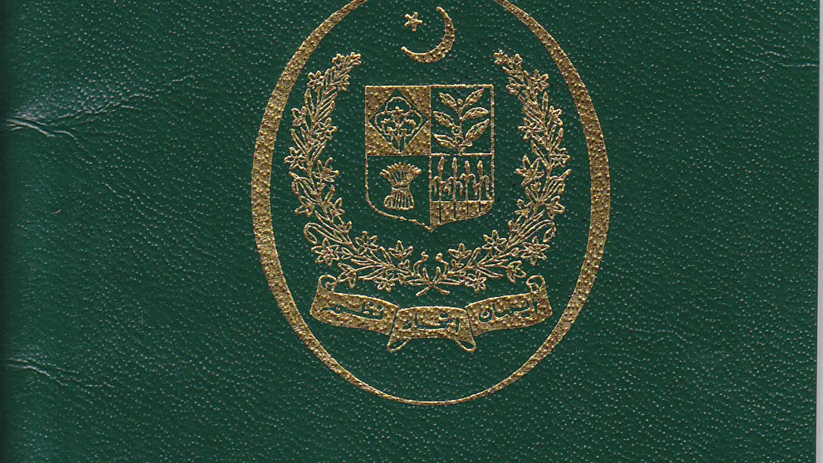 The green cover of a Pakistani passport with the state emblem in gold