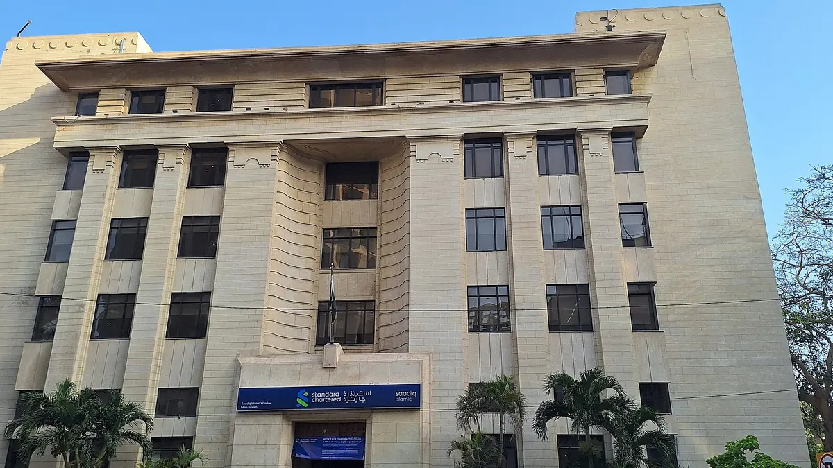 Standard Chartered's Saadiq main branch, a cream stone building on I.I. Chundrigar Road, Karachi